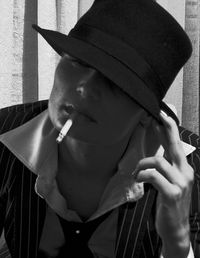 Woman with hat and cigarette