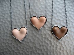 Margaux Lange Barbie boobs heart necklaces