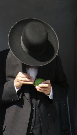 Man with etrog Four Species Market Ron Almog
