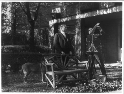 Herbert Hoover poses for movie camera